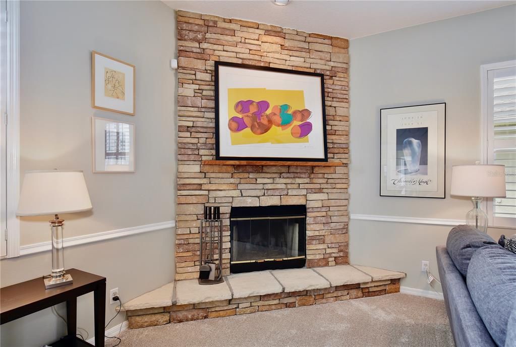 Accent lighted stone fireplace