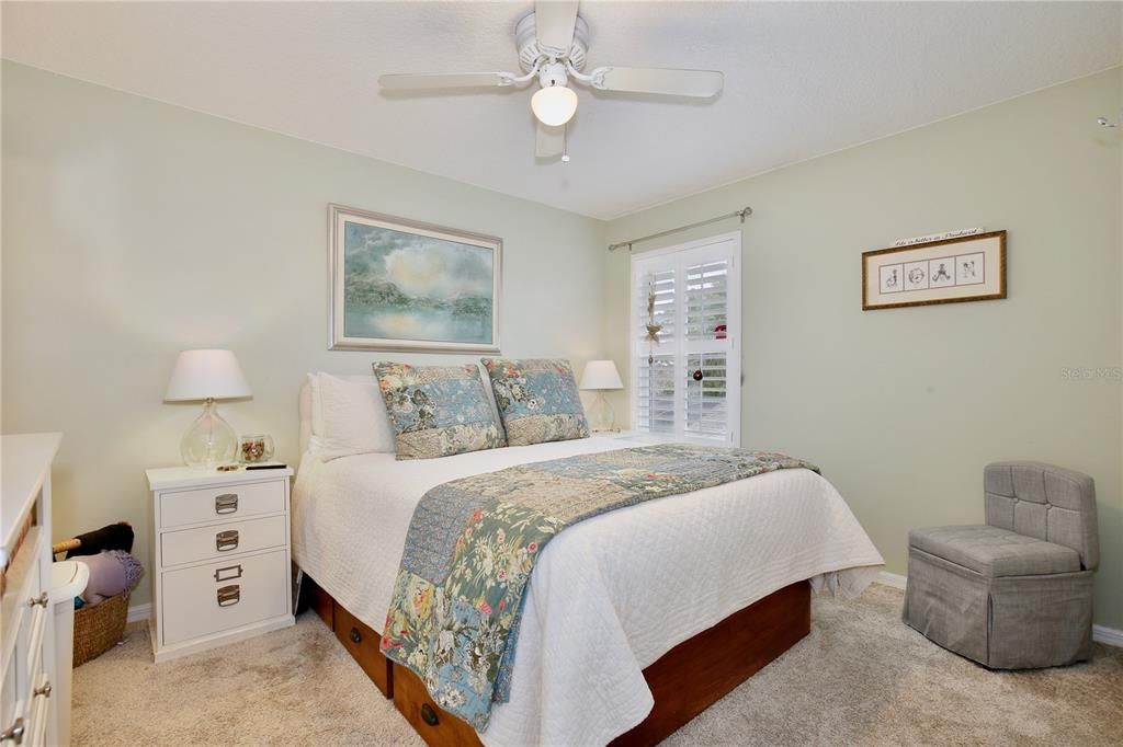 Bedroom 4, plantation shutters, extra large closet, ceiling fan.