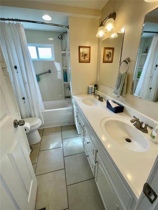 Hall bath has been all updated very nicely with double sinks, bathtub/shower