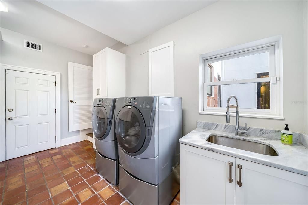 Downstairs laundry is one of two laundry rooms.