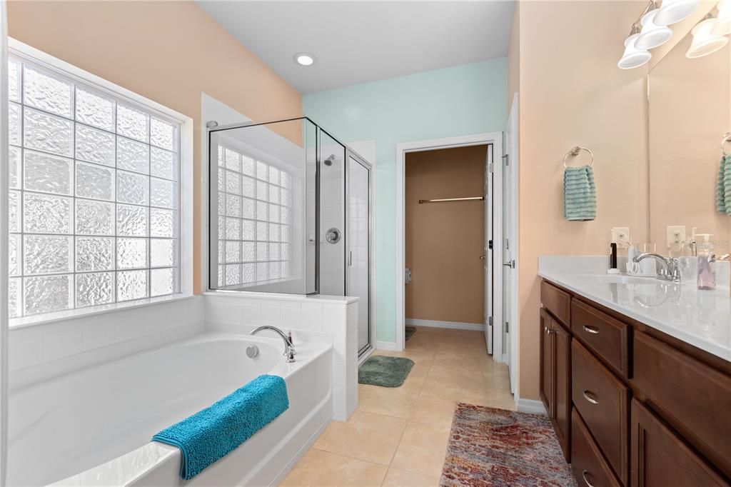 PRIMARY BATH WITH DUEL SINKS, GARDEN TUB AND GLASS BLOCK WINDOW FOR TONS OF LIGHT!