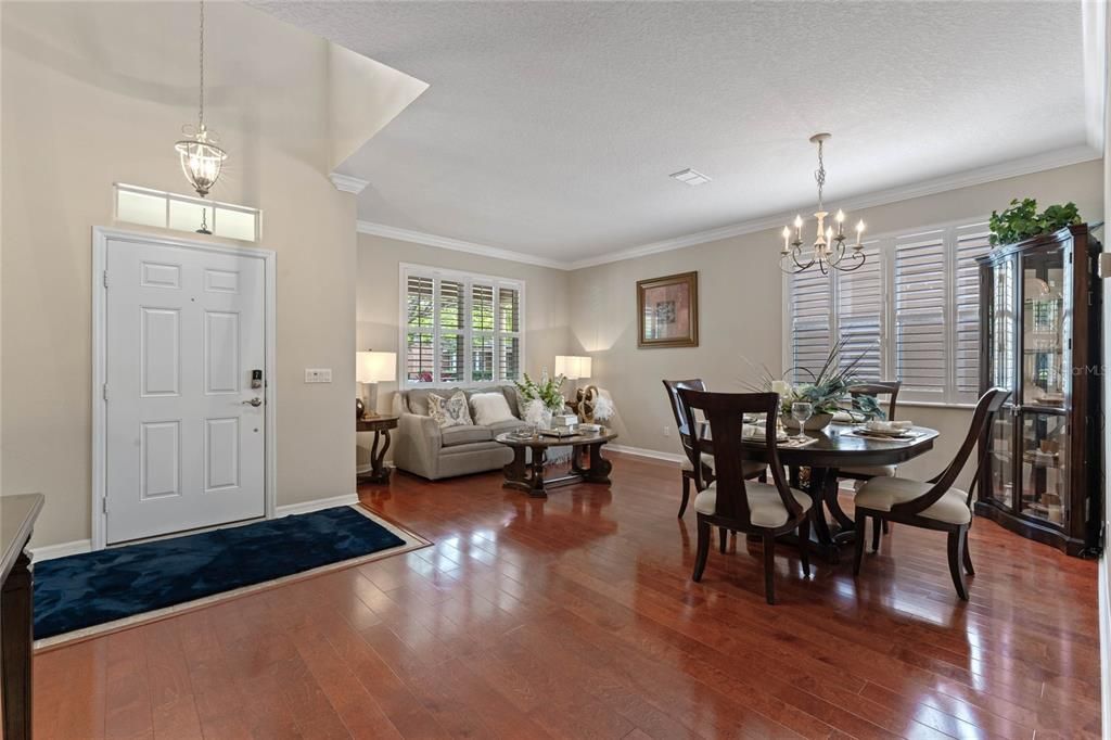 Step through the front door to formal living & dining graced with hardwood floors, crown molding and plantation shutters. This home offers an open concept plan with both formal & casual living and dining options making entertaining a breeze.