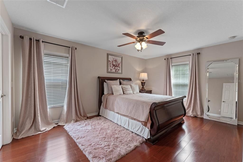 Spacious Bedroom #1 is 11.5FT x 16.5FT large enough for king, 2 twins, bunk beds, or whatever you might need. New blinds, new hardwood floors & a large walk-in closet are highlights of this space.