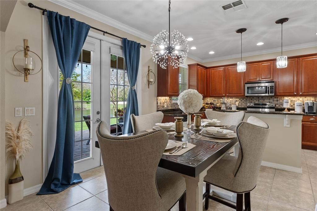 Casual Dining off the kitchen. Check out the views off the porch through the French doors!