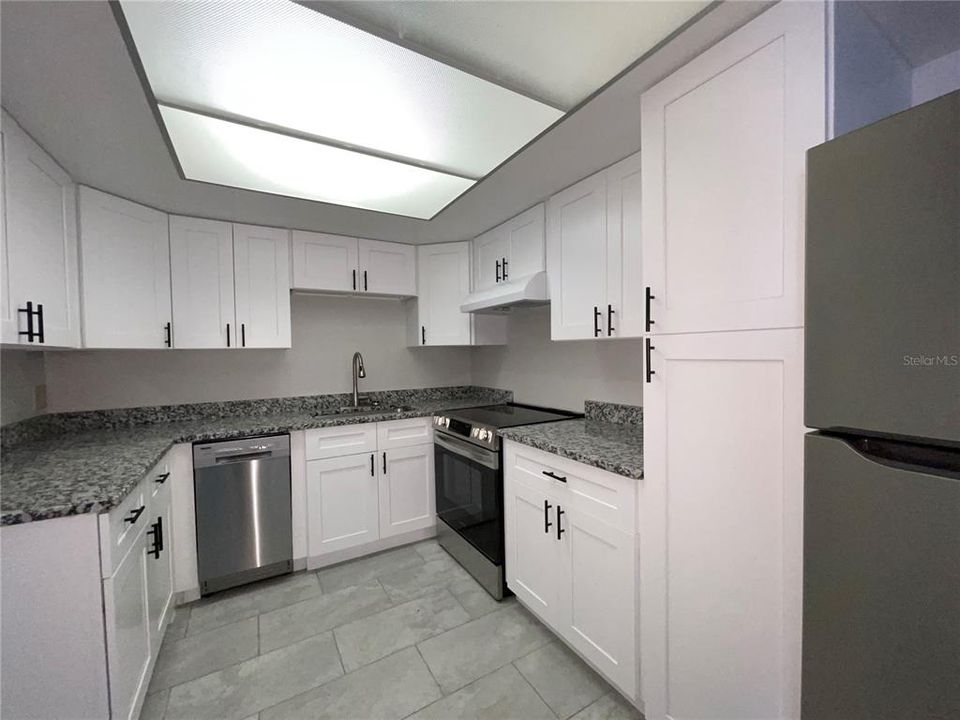 Kitchen with Granite counters and New Stainless Steel Appliances
