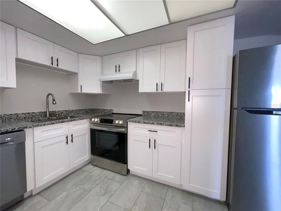 Kitchen with Granite counters and New Stainless Steel Appliances