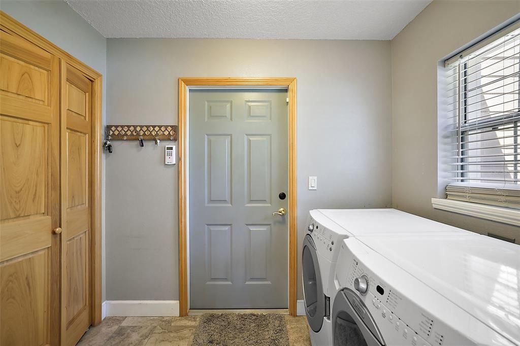 Laundry room; with entry to the 2-car garage