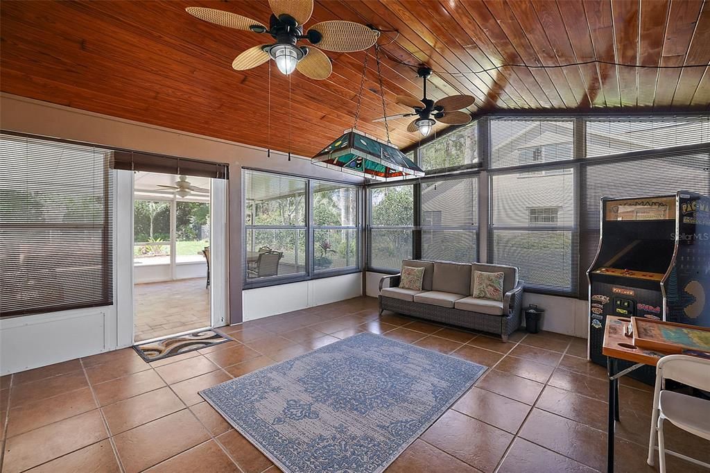 Enclosed Florida room with tile and coved wooden ceiling