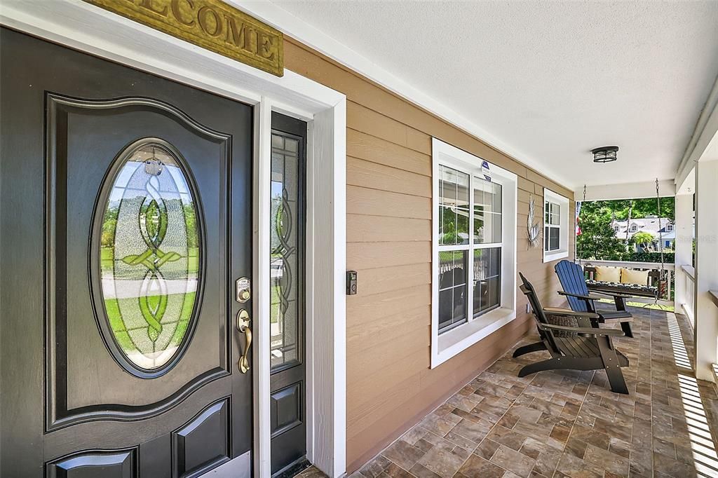 Enjoy a cocktail while relaxing on the charming and inviting front porch
