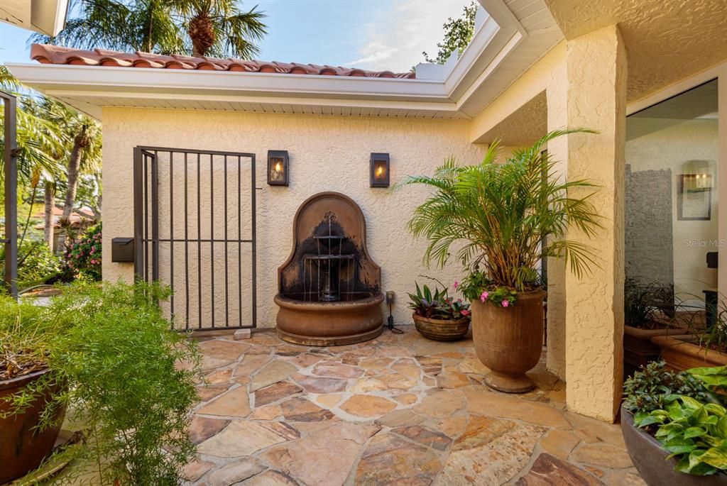 A fountain in your Courtyard entry