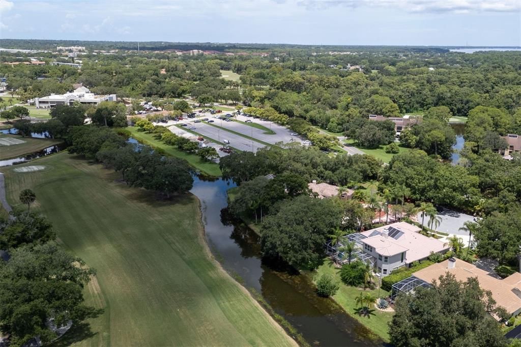 Aerial view of home, Hole #1 of esteemed North course, water and country club (walking distance golf cart ride away!).