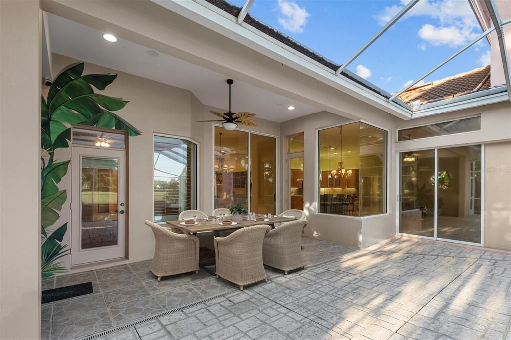 Large COVERED screened dining area in oversized custom pool area