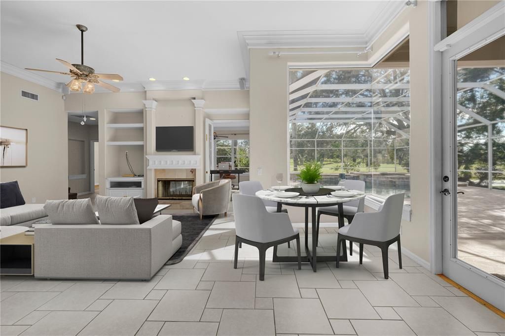 STAGED - View from kitchen looking toward family room, fireplace, home office/bonus room, 4th BR/pool bath