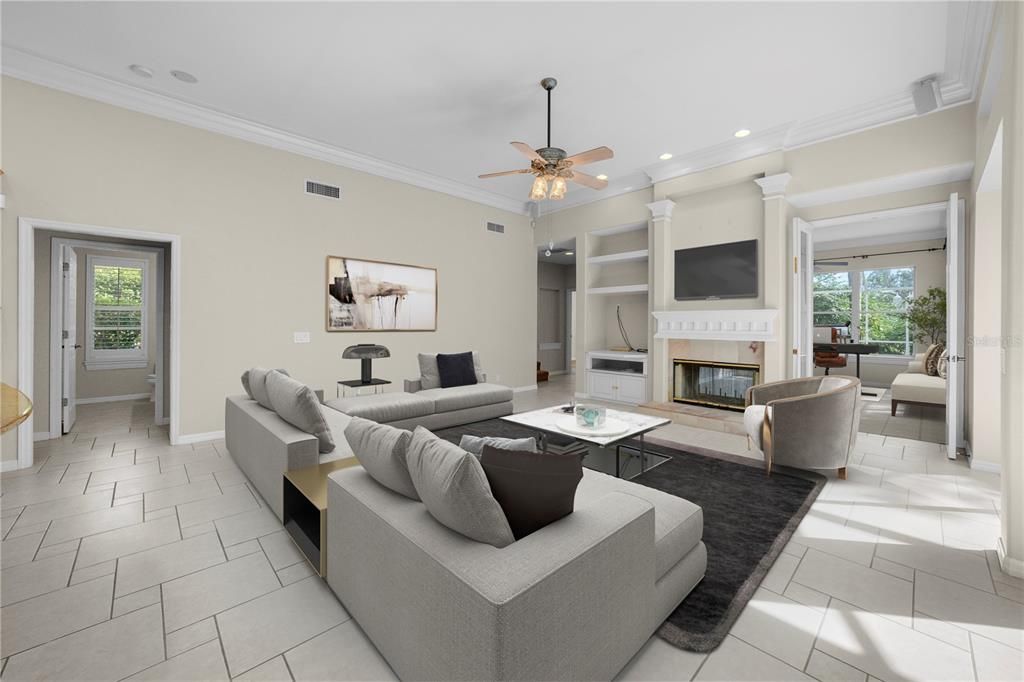 STAGED -View from Secondary bedrooms to living room, fireplace, home office/bonus room, pool bath, 4th bedroom