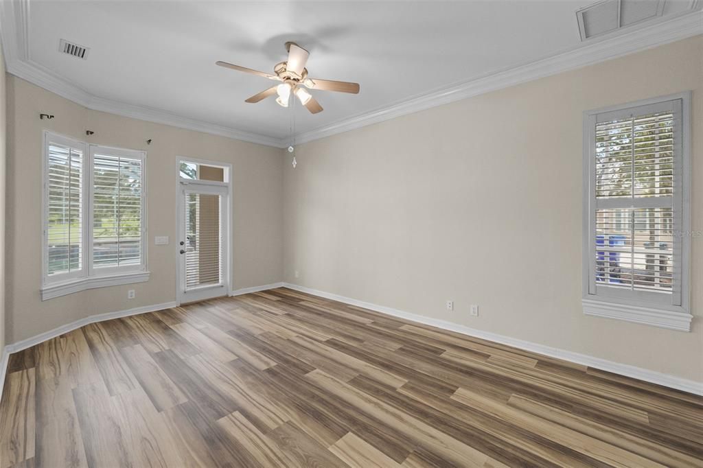 Master bedroom with pool access/view of golf course