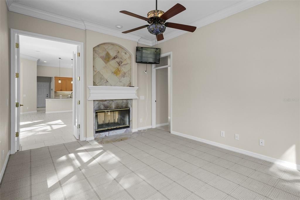 Another view of downstairs home office/bonus room  looking toward double fireplace/family room/hall to guest suite and pool bath in right-hand corner