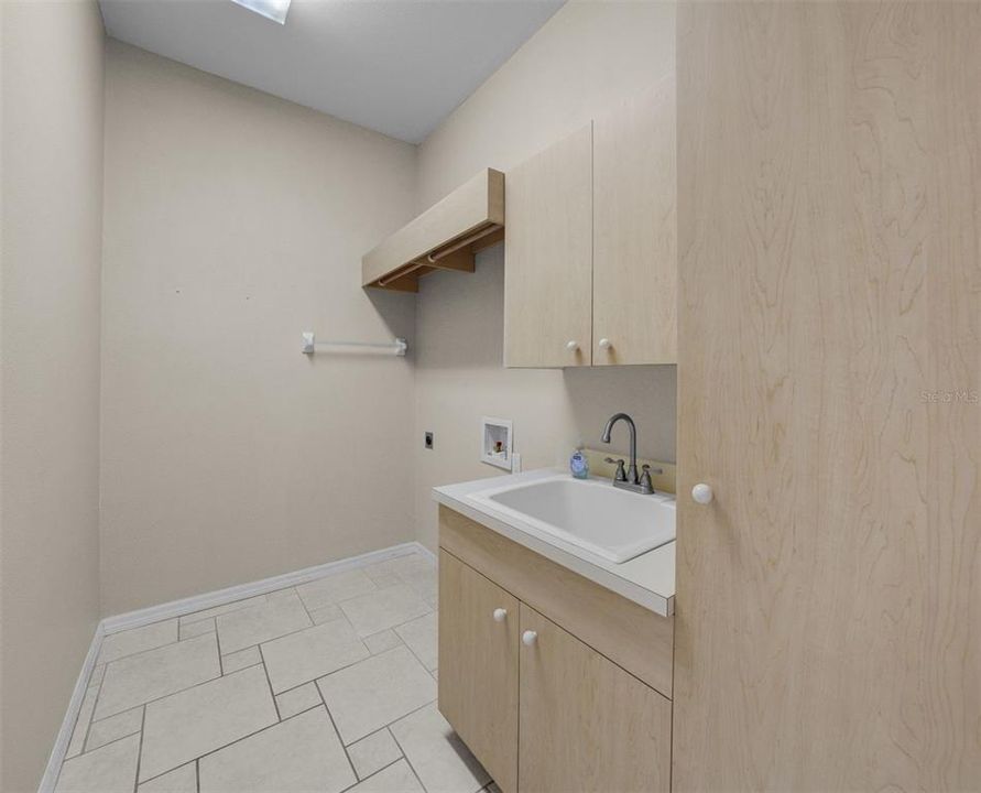 Laundry room with utility sink - adjacent to garage.