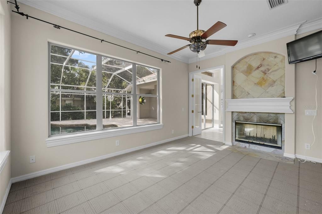 Another view of downstairs home office/bonus room  looking toward double fireplace/family room