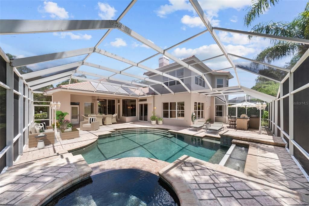 Marc Rutenberg signature custom resort-style pool/spa package.  No other  like it in ELW - extended pool deck, oversized pool steps & water feature,  multiple lounging shelves, elevated/oversized heated spa (propane and solar).