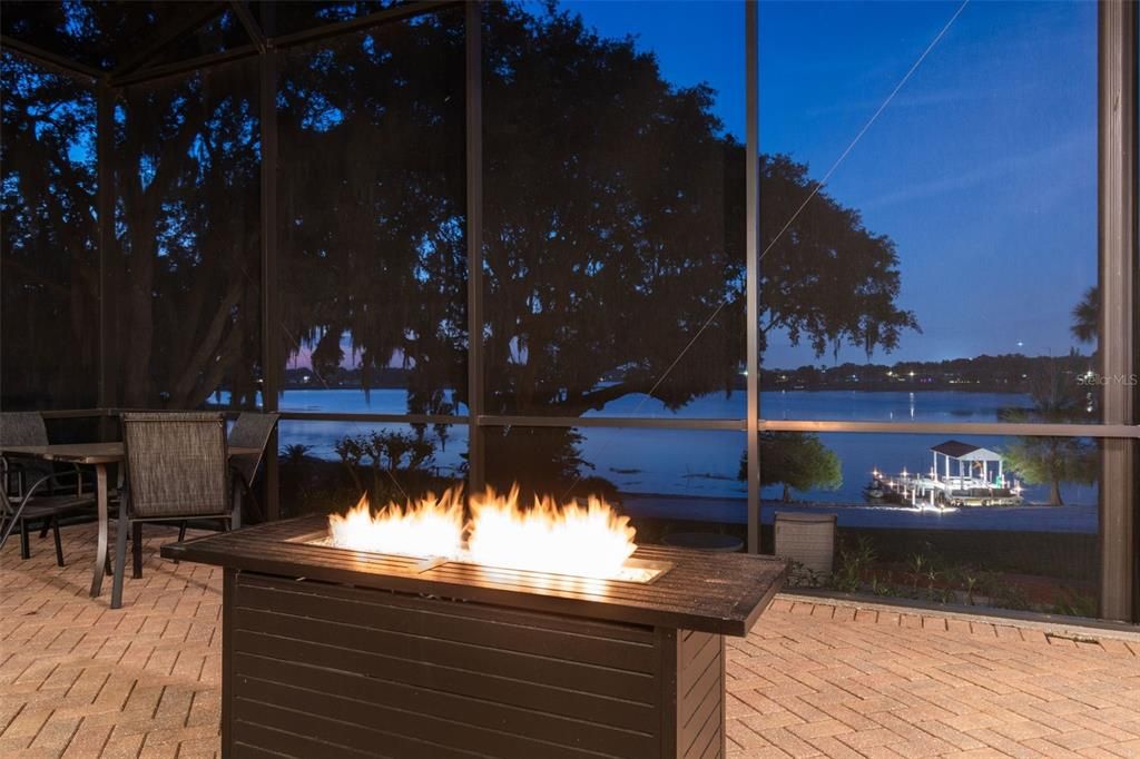 Relax by the fire pit and just look at the lake and your well lighted boat dock