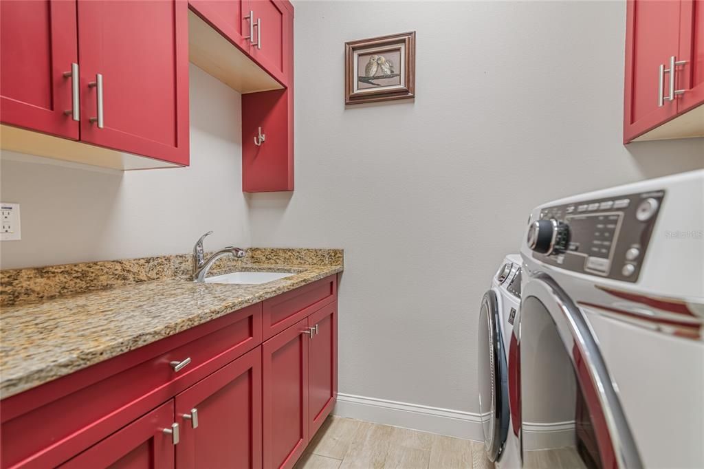 Inside Laundry Room with built-in deep sink.