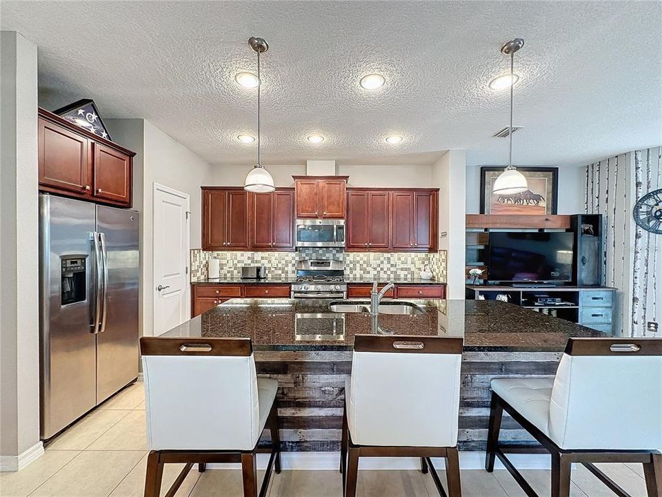 LARGE ISLAND, GRANITE COUNTERTOPS and a WALK-IN PANTRY add to the quality and convenience of this home