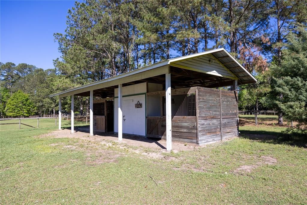 Horse stable w 2 stalls and covered area and tack room