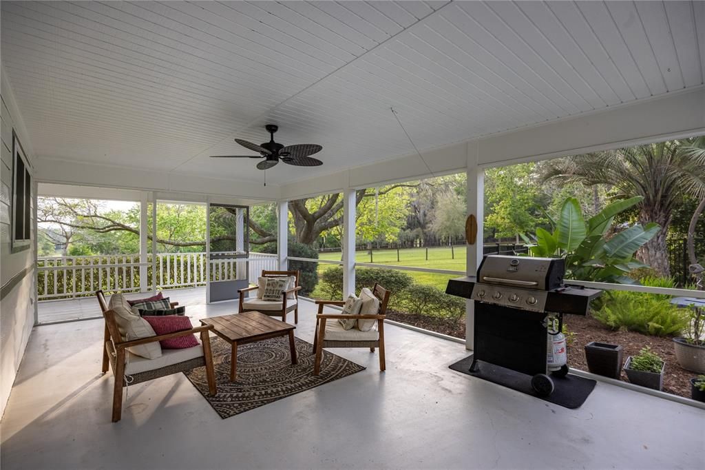 Screened porch overlooks the pool