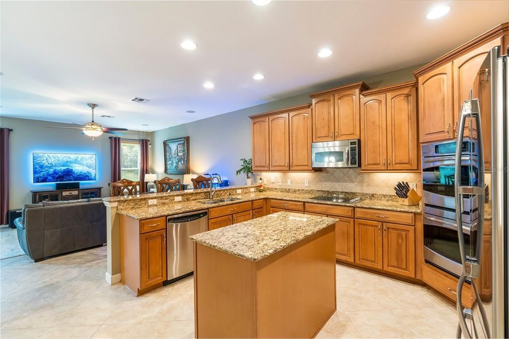 Well-equipped Kitchen with Granite Counters and Stainless Appliances