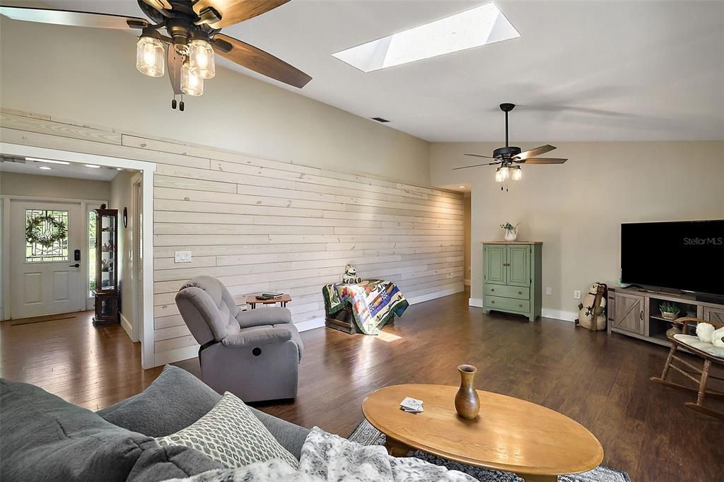 Living Room has Vaulted Ceilings and one Shiplap Accent Wall.