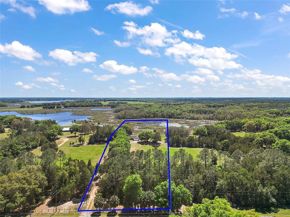 Aerial View of Property Boundary with Canal and Lake.