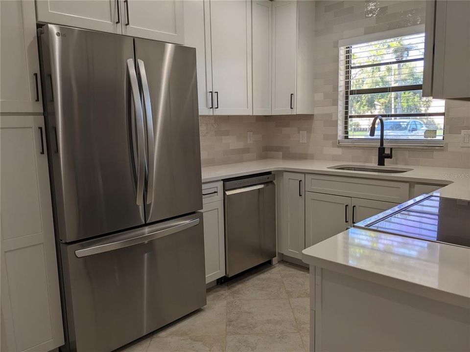 42 in cabinets, soft close doors, quartz countertops, new stainless steel appliances