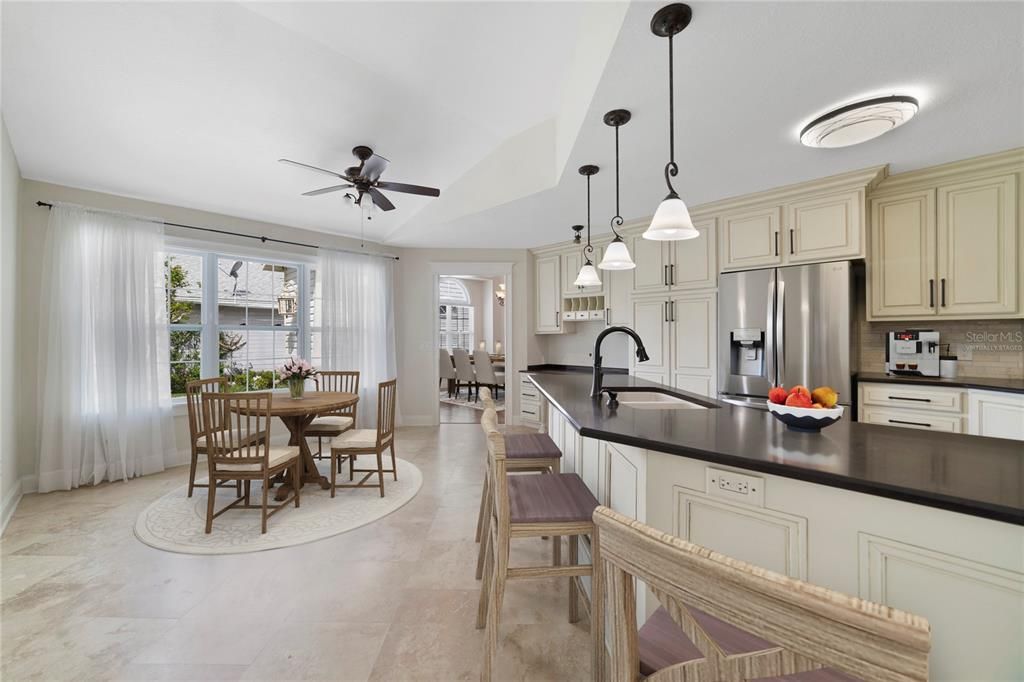 The home chef will fall in love with the well equipped kitchen boasting timeless cabinetry and ample counter space, STAINLESS STEEL APPLIANCES and a casual dining space in front of another large window! Virtually Staged.