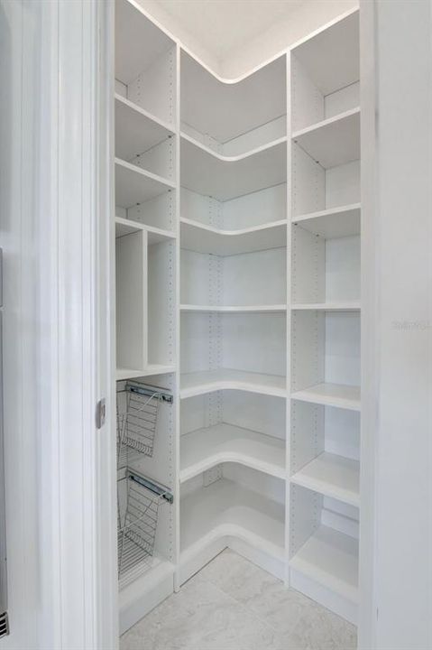 Walk-in pantry with custom shelving