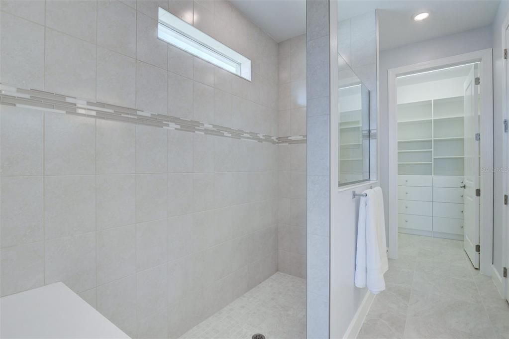 Owner's bathroom walk-in shower with 3/8 glass enclosure