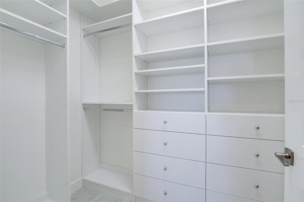 Owner's closet with custom shelving