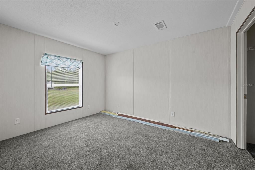 2nd bedroom with walk in closest - Stock photo from builder - Under construction