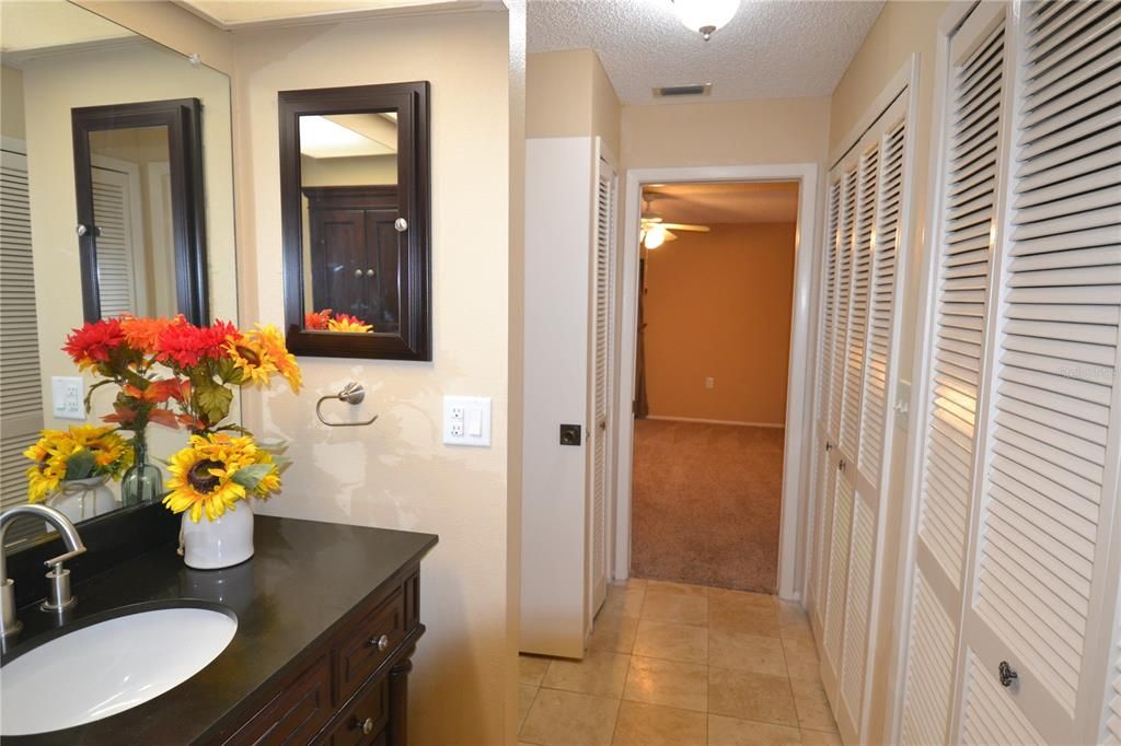 Bedroom hall from vanity and closets on right