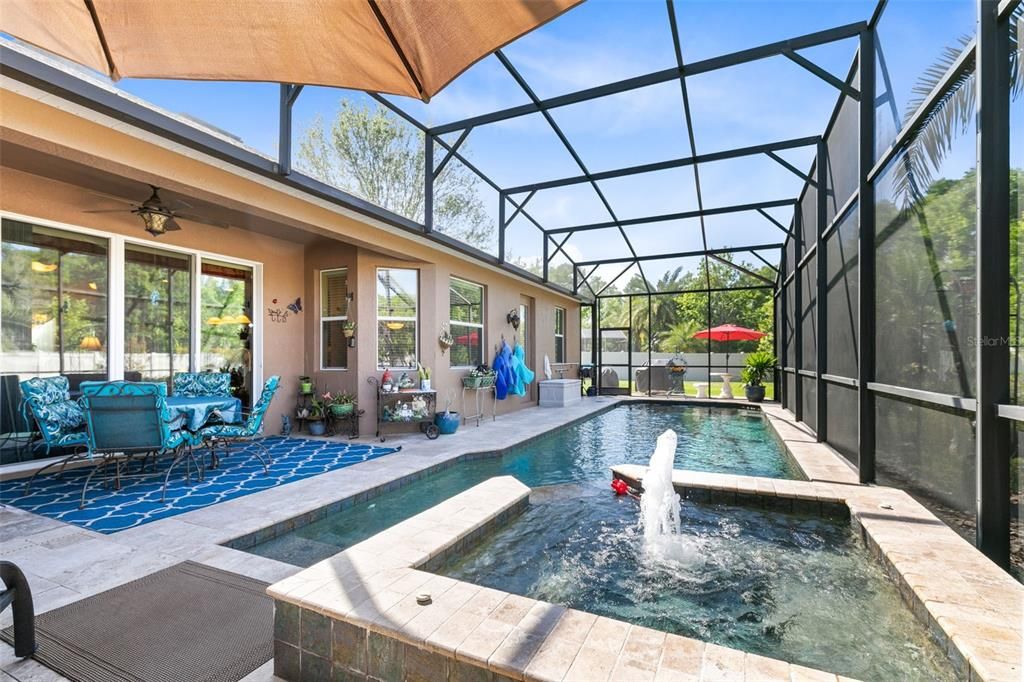 A covered lanai overlooks the pool.