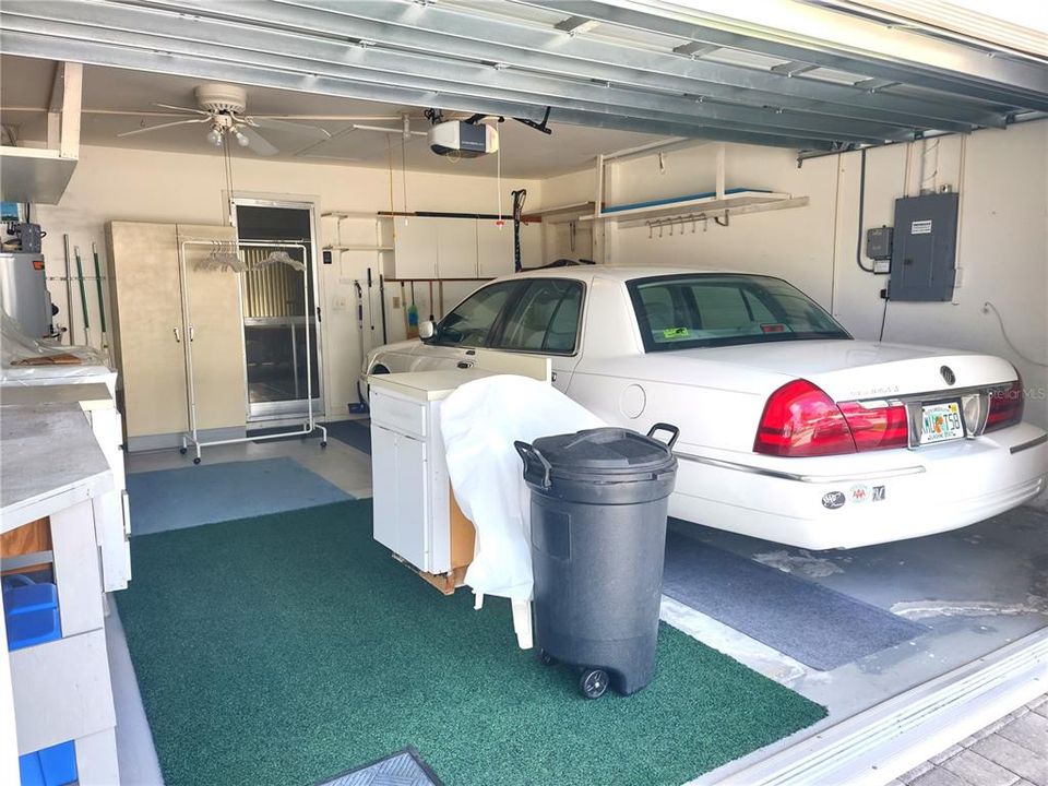 Spacious garage can accommodate a car and golf cart