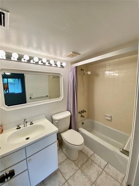 ensuite bathroom to primary bedroom, tub/shower