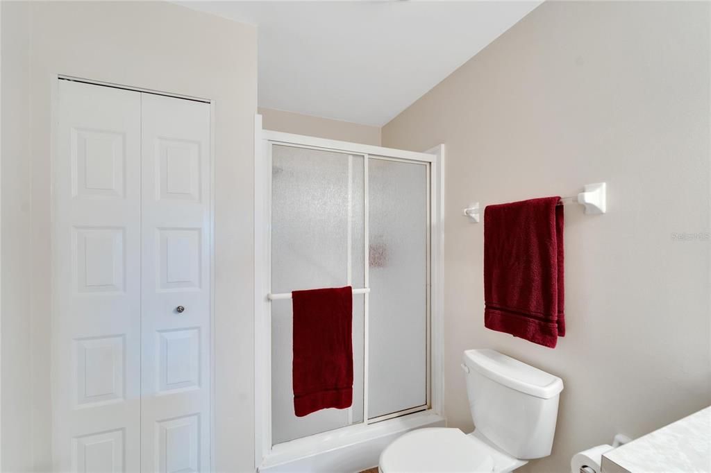 Primary bath with shower and linen closet
