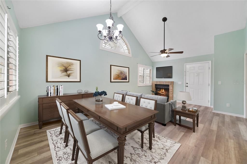 The LIVING & DINING ROOM COMBO showcases a lovely FIREPLACE with a BRICK SURROUND, making this a wonderful space to entertain guests! Virtually Staged.