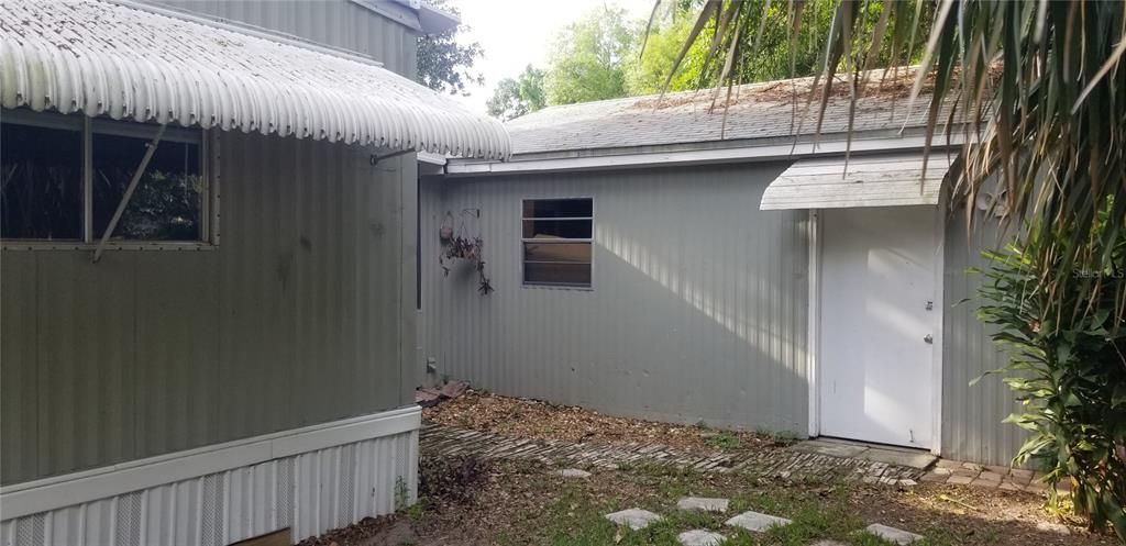 216 Kaylor - side door of garage with shingle roof.