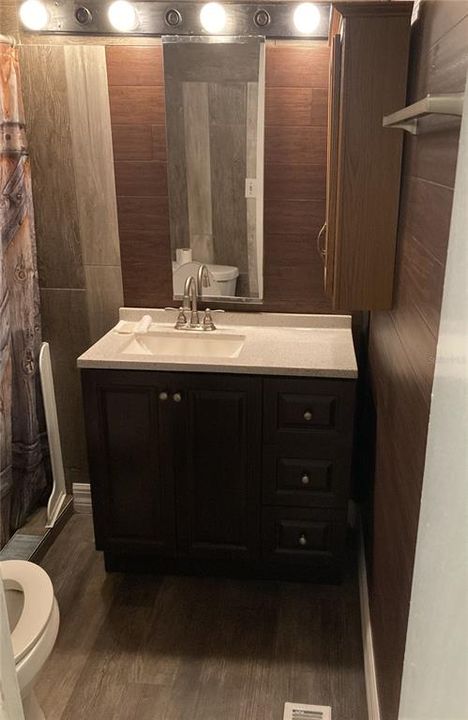 Updated bathroom with modern vanity.