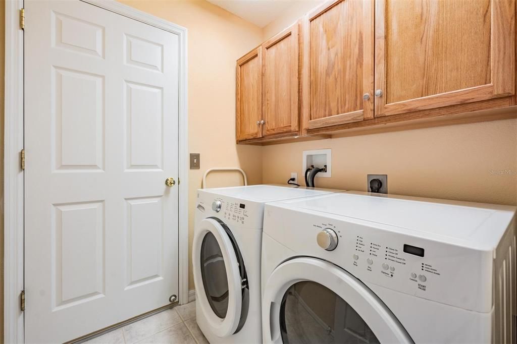 Walk-in laundry room with storage