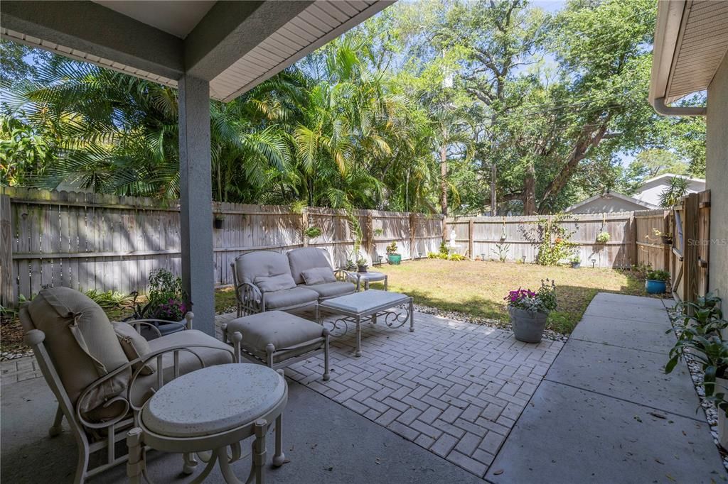 Inviting back patio and fenced in yard.