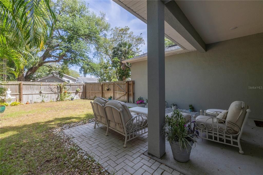 Inviting back patio and fenced in yard.