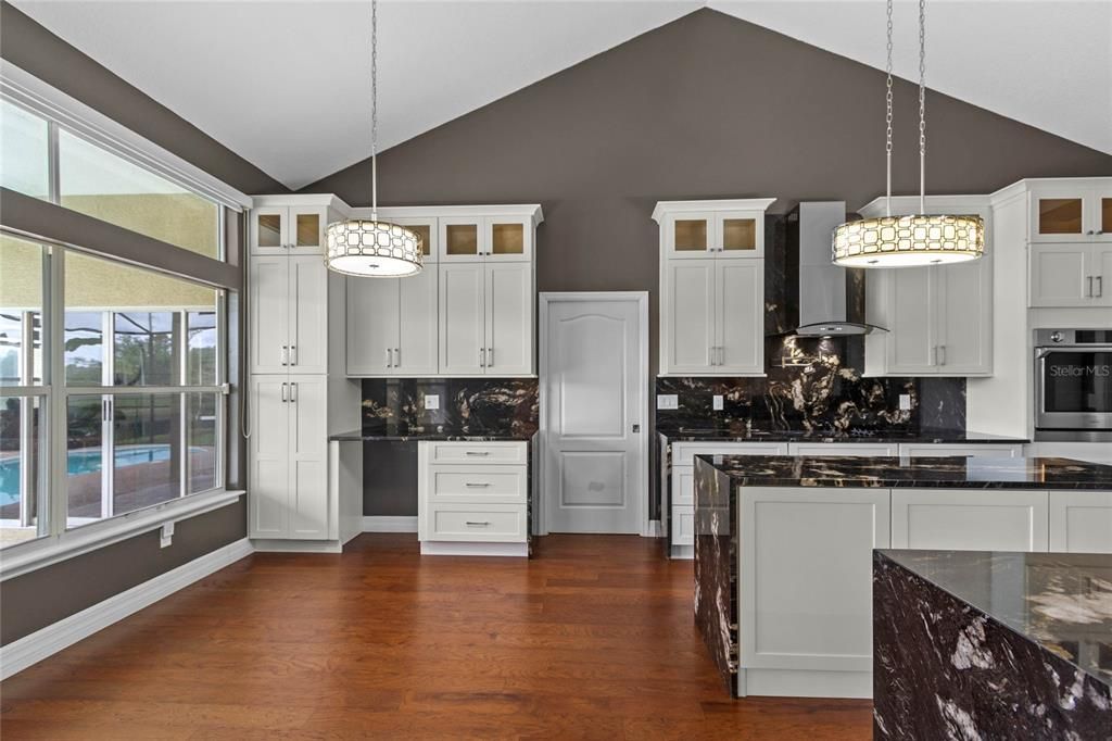The kitchen features a cozy breakfast nook and dry bar with space for a wine cooler.