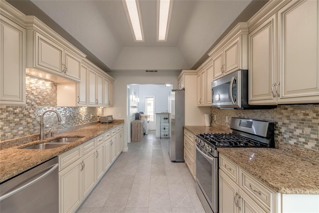 Kitchen with stainless steel appliances and natural gas range